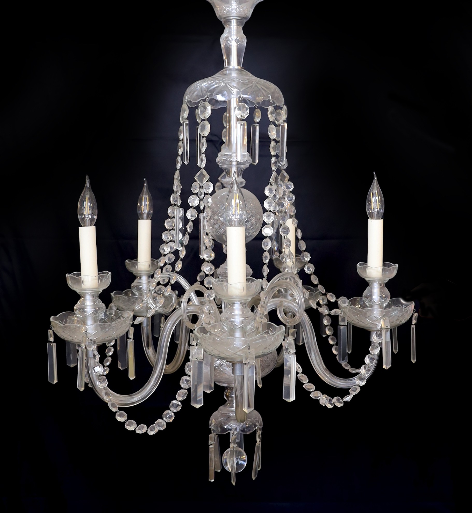 A 1930s Czech cut glass five light chandelier with octagonal bead and bayonet drops, height 100cm. width 65cm